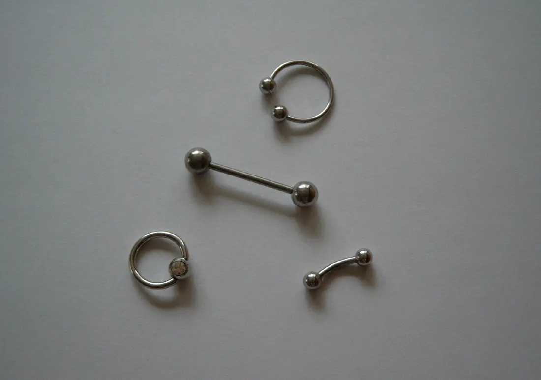 Two captive bead rings, a straight barbell and a curved barbell