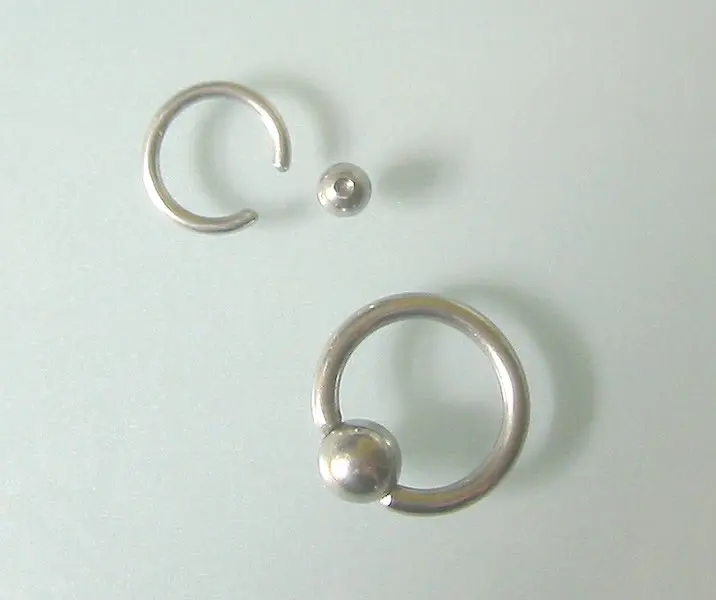 Two captive bead rings, each holding its bead by tension between the ends of the ring
