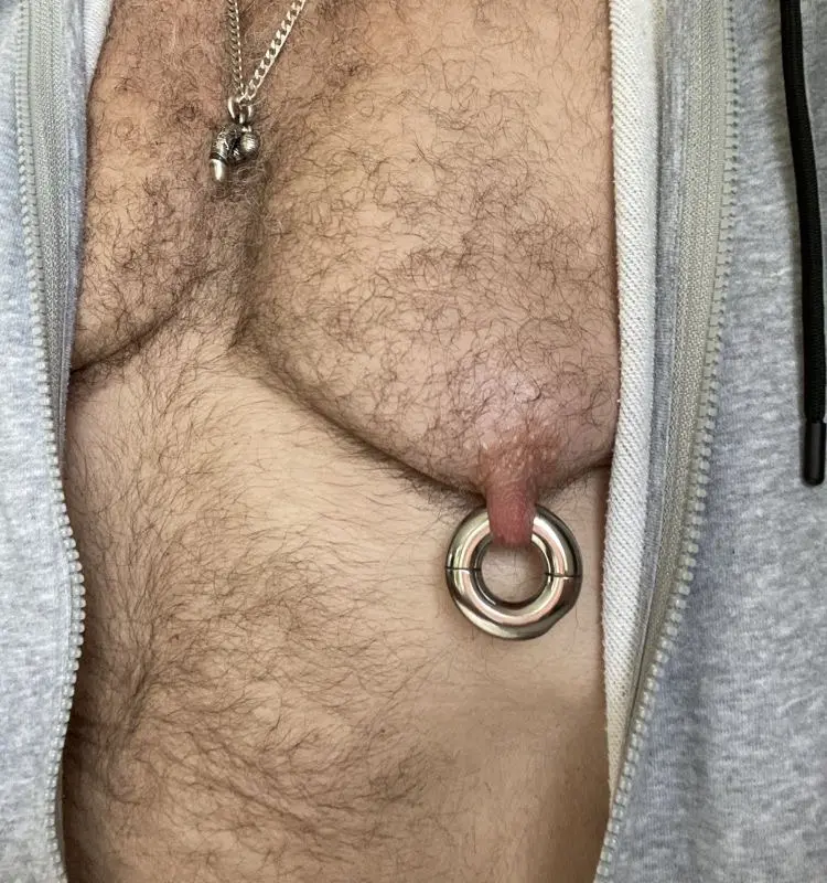 A captive bead ring through a healed nipple piercing