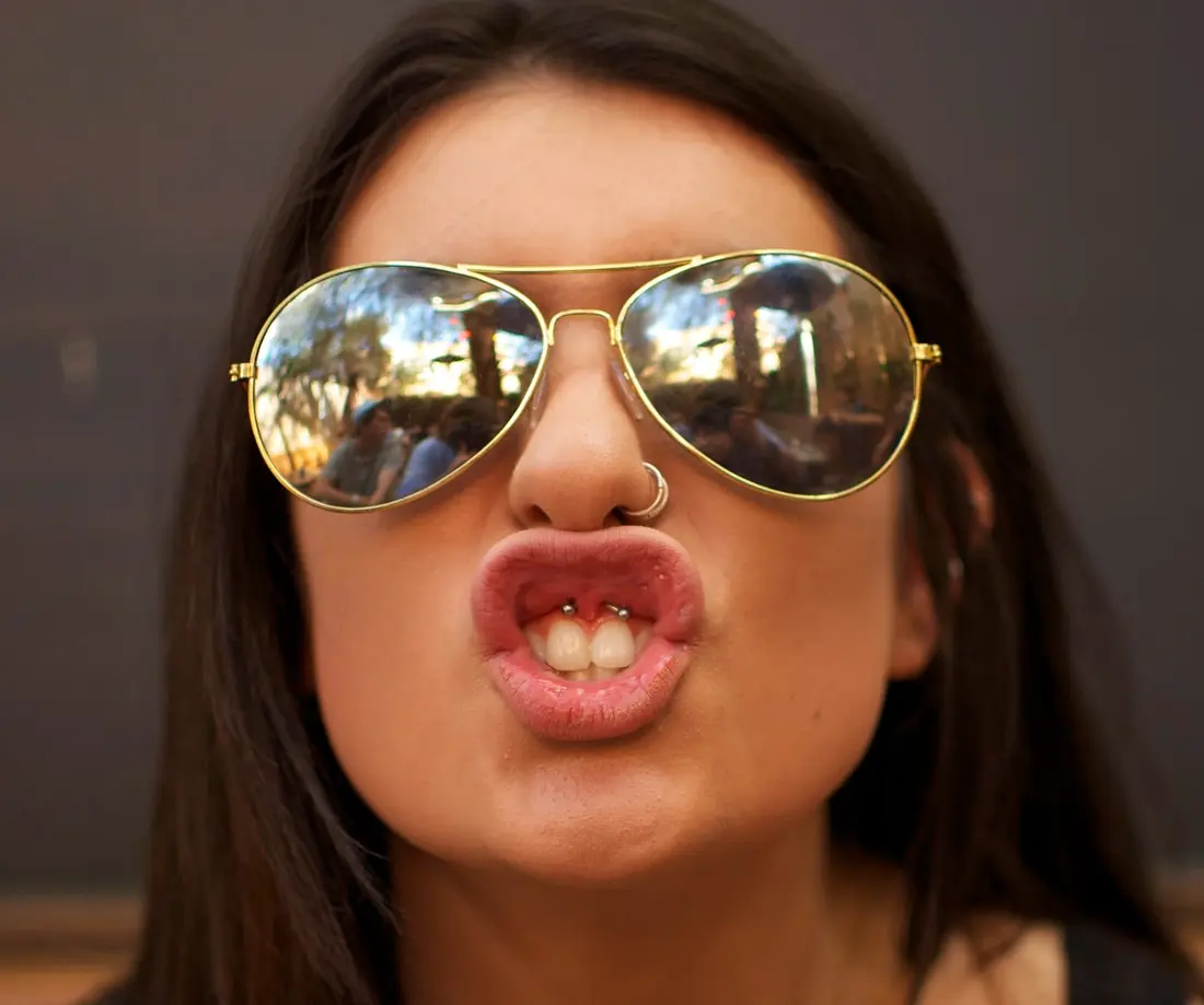 A ring through the upper lip frenulum, visible only because the lip is lifted